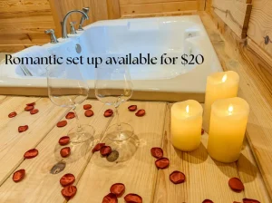 Candles and rose pedals next to the hot tub